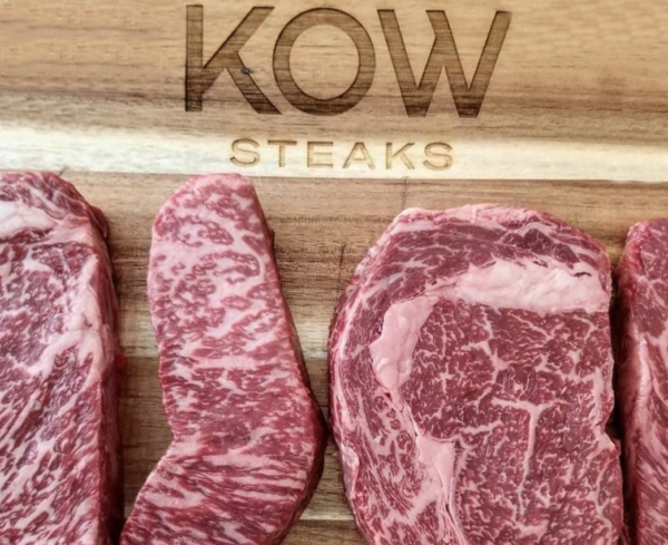 Kow Wagyu Steaks on wooden cutting board